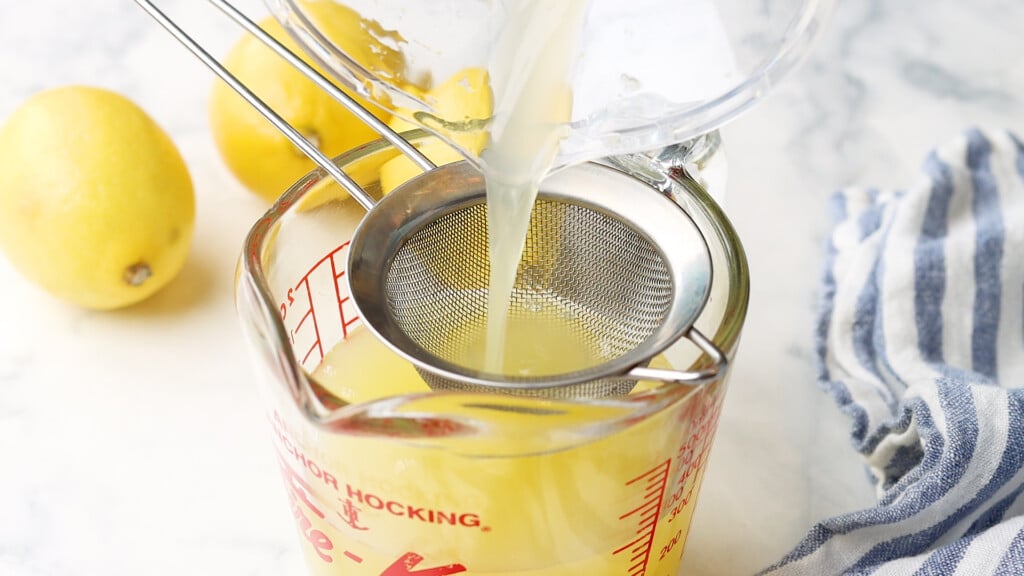 lemon juice being strained