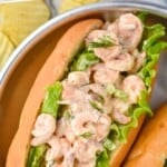 Pinterest graphic for Shrimp Salad recipe. Text says, "crazy good Shrimp Salad simplejoy.com." Image is overhead photo of Shrimp Salad sandwich.