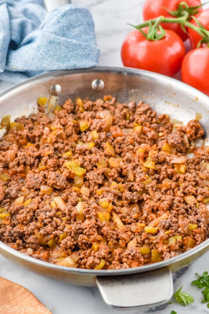 Overhead photo of a skillet of ingredients for Beef Enchiladas recipe.