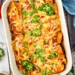 Overhead photo of a baking dish of Beef Enchiladas on a cooling rack. - 17