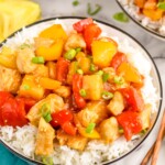 Overhead photo of Pineapple Chicken served in a bowl of rice.