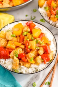 Overhead photo of Pineapple Chicken served in a bowl of rice.