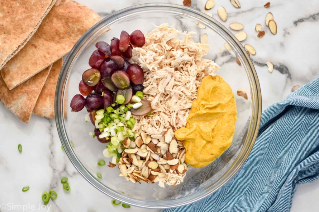 Overhead photo of mixing bowl of ingredients for Curry Chicken Salad recipe