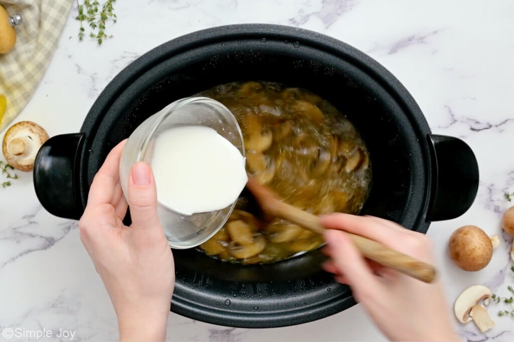 overhead of corn starch slurry being poured into a slow cooker