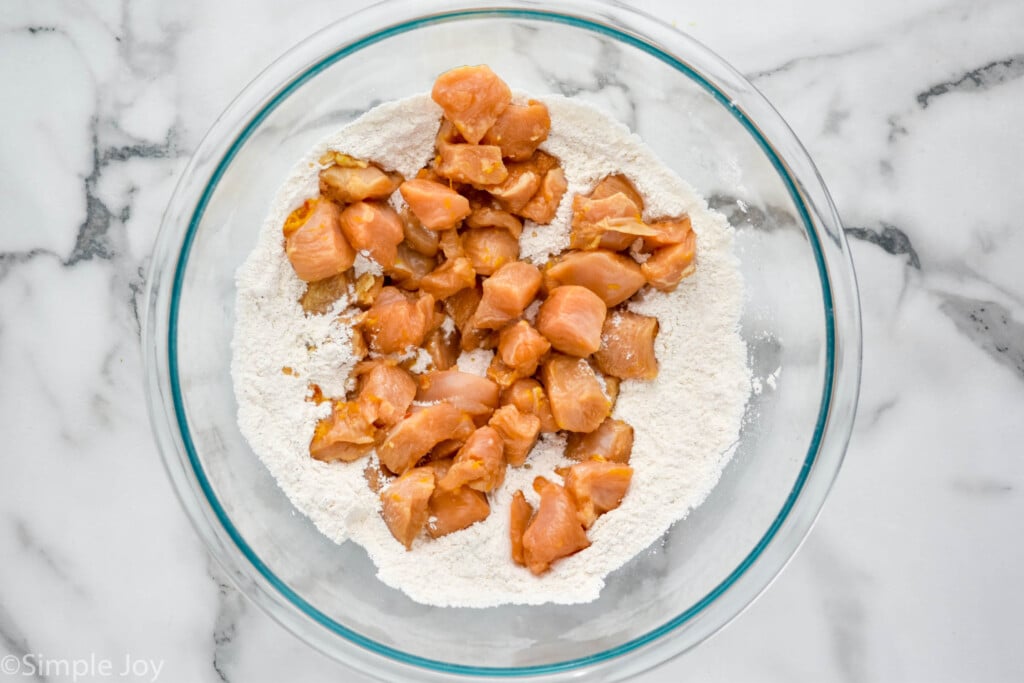 Overhead photo of a mixing bowl of ingredients for Orange Chicken recipe.