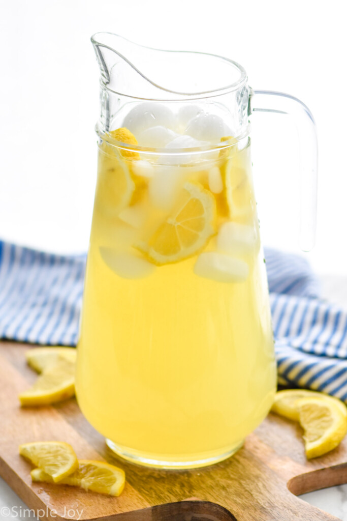 Overhead photo of a pitcher of Lemonade garnished with lemon slices.
