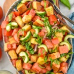 Overhead photo of Panzanella Salad with forks for serving. - 10