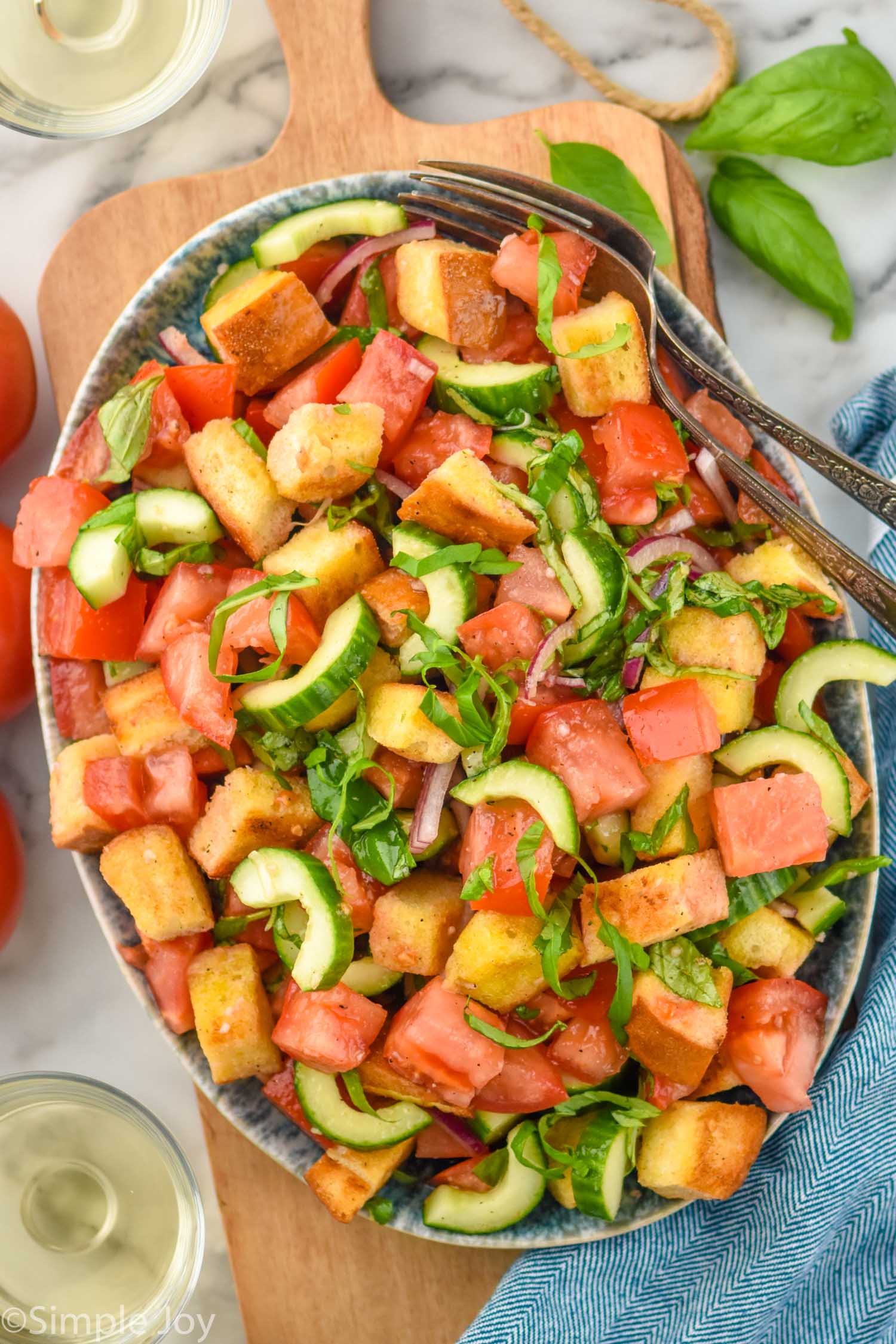 Overhead photo of Panzanella Salad with forks for serving.