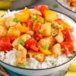 Close up photo of Pineapple Chicken served in a bowl of rice.