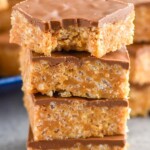 Photo of a stack of Scotcheroos with a bite taken out of the top Scotcheroo - 13