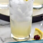 Pinterest graphic for Tom Collins cocktail. Image shows Tom Collins cocktail with ice, straw, and lemon wedge cherry garnish. Text says "Tom Collins simplejoy.com"