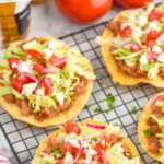 pinterest graphic of four bean tostadas on a cooling rack, says: "amazing bean tostadas, simplejoy.com"