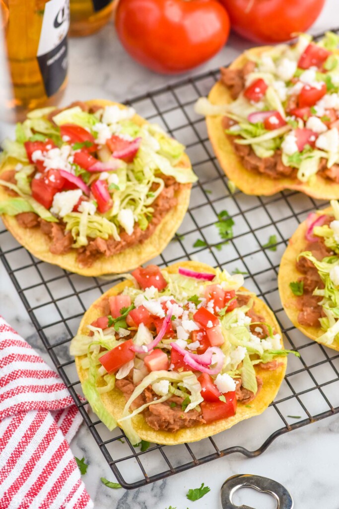 four bean tostadas on a cooling rack