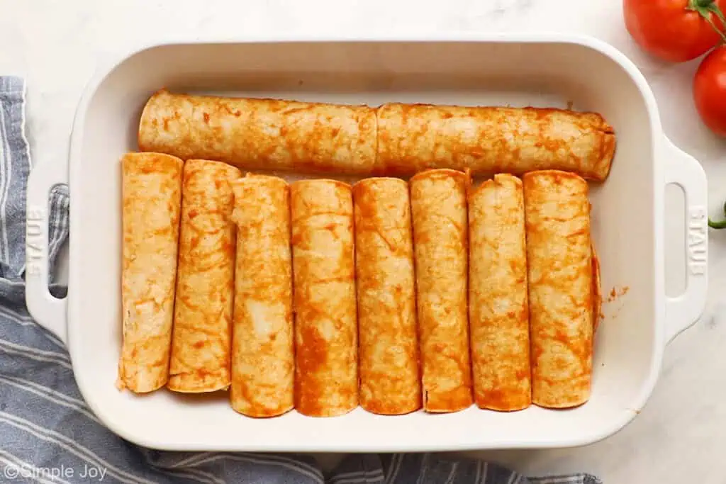 rolled enchiladas in a baking dish