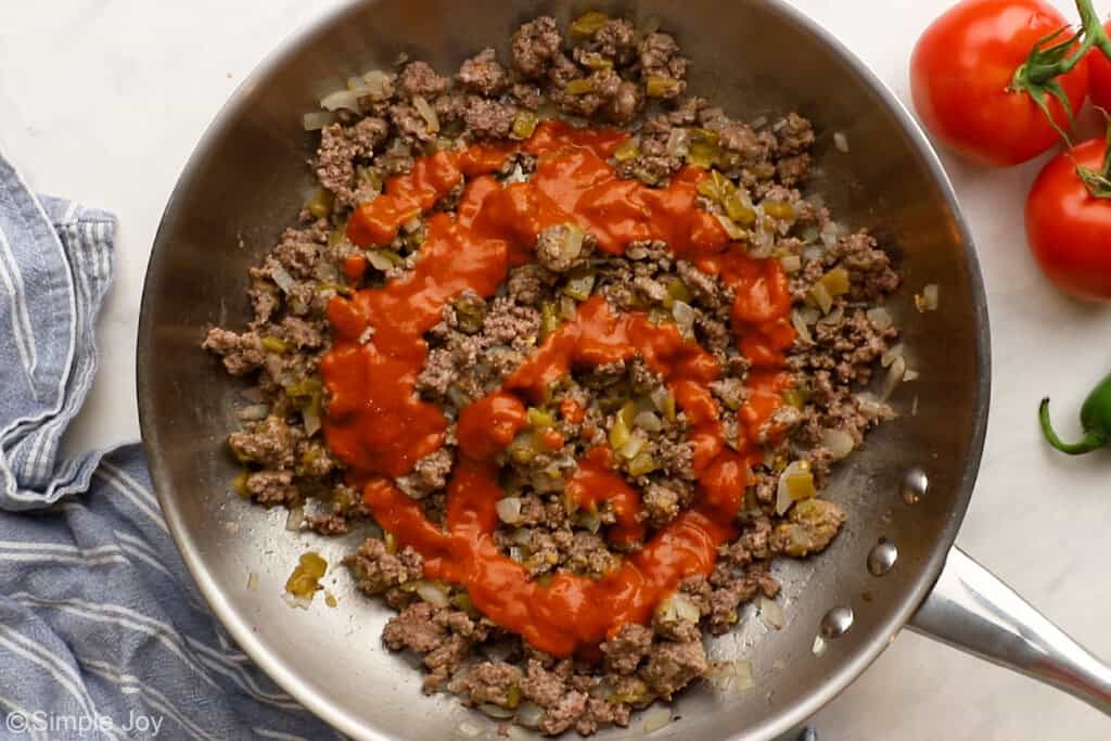 enchilada sauce added to ground beef to make beef enchiladas