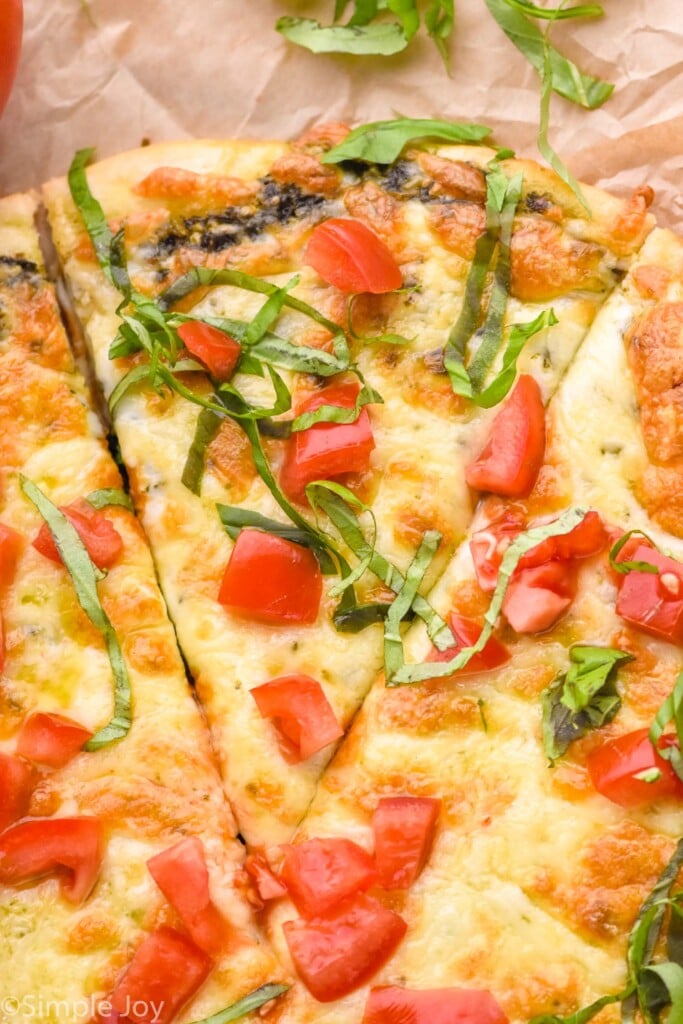 Overhead photo of Pesto Pizza cut into slices