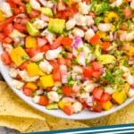 Pinterest graphic for Shrimp Ceviche. Image shows overhead view of bowl of Shrimp Ceviche surrounded by tortilla chips. Text says "Shrimp Ceviche simplejoy.com"