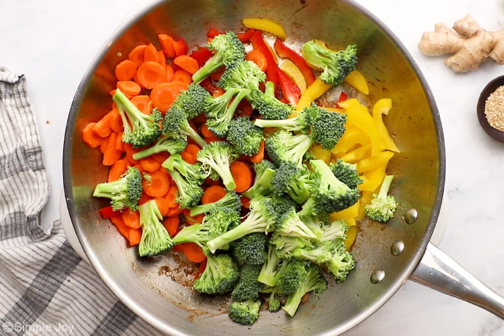 overhead of vegetables cooking for beef stir fry