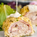 spoon dropping Chicken Cordon Bleu sauce on Chicken Cordon Bleu - 13