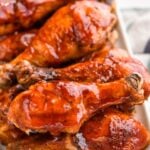 plate full of grilled chicken legs sitting on a striped napkin - 11