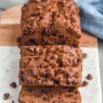 Loaf of Chocolate Banana Bread sliced on a serving board - 11