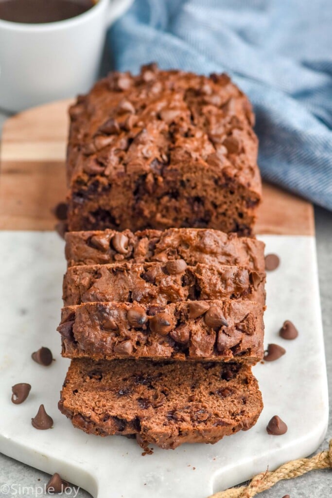 Loaf of Chocolate Banana Bread sliced on a serving board