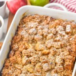 Pinterest graphic for Apple French Toast Casserole recipe. Text says, "apple pie french toast casserole simplejoy.com" Image shows baking dish of Apple French Toast Casserole