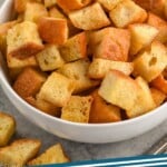 Pinterest graphic for Croutons recipe. Image is close up photo of a bowl of Croutons. Text says, "crouton recipe simplejoy.com"