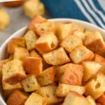 Pinterest graphic for Croutons recipe. Text says, "homemade crouton recipe simplejoy.com." Image is close up photo of a bowl of Croutons.