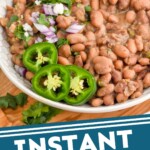 Pinterest graphic for instant pot pinto beans. Image shows a bowl of instant pot pinto beans garnished with diced jalapeno, red onion, and cilantro. Text says "Instant Pot Pinto Beans simplejoy.com"