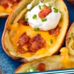 Pinterest graphic for Potato Skins recipe. Image is close up photo of Potato Skins. Text says, "Potato Skins simplejoy.com"