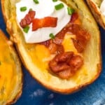 Pinterest graphic for Potato Skins recipe. Image is close up photo of Potato Skins. Text says, "super easy Potato Skins simplejoy.com"