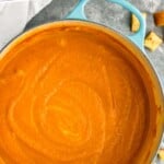 Pinterest graphic for Pumpkin Soup recipe. Text says, "amazing Pumpkin curry Soup simplejoy.com." Image is overhead photo of a pot of Pumpkin Soup