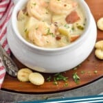 Pinterest graphic for Seafood Chowder Recipe. Image shows bowls of Seafood Chowder Recipe with oyster crackers beside them. Text says, "Seafood Chowder simplejoy.com"