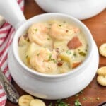 Photo of bowls of Seafood Chowder Recipe with oyster crackers beside bowls - 17