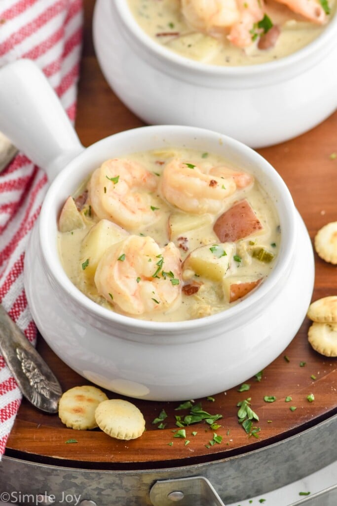 Photo of bowls of Seafood Chowder Recipe with oyster crackers beside bowls