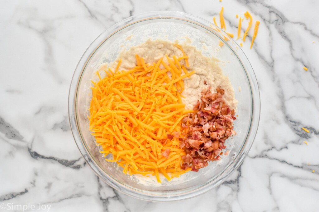 Overhead photo of a mixing bowl of ingredients for Bacon Cheese Beer Bread recipe