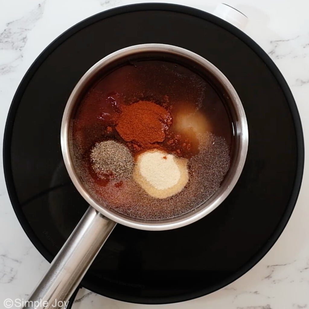 overhead of a small sauce pan with the ingredients for bbq sauce