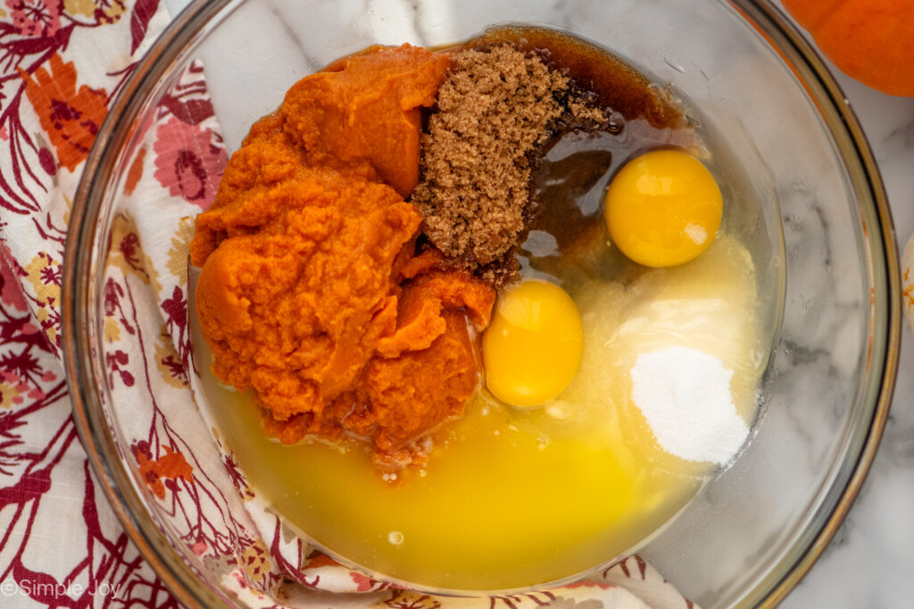 pumpkin, sugar, brown sugar, eggs, and melted butter in a bowl