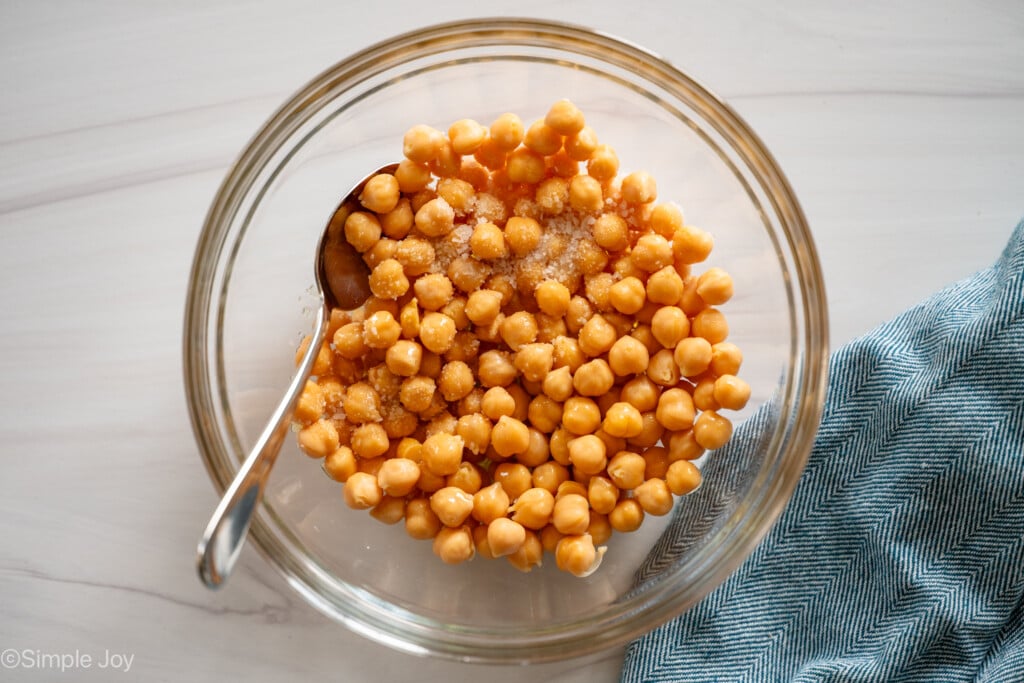 overhead of a bowl of chickpeas with salt and oil - 7