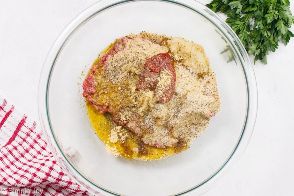 meat and spices combined in a bowl to make salisbury steak