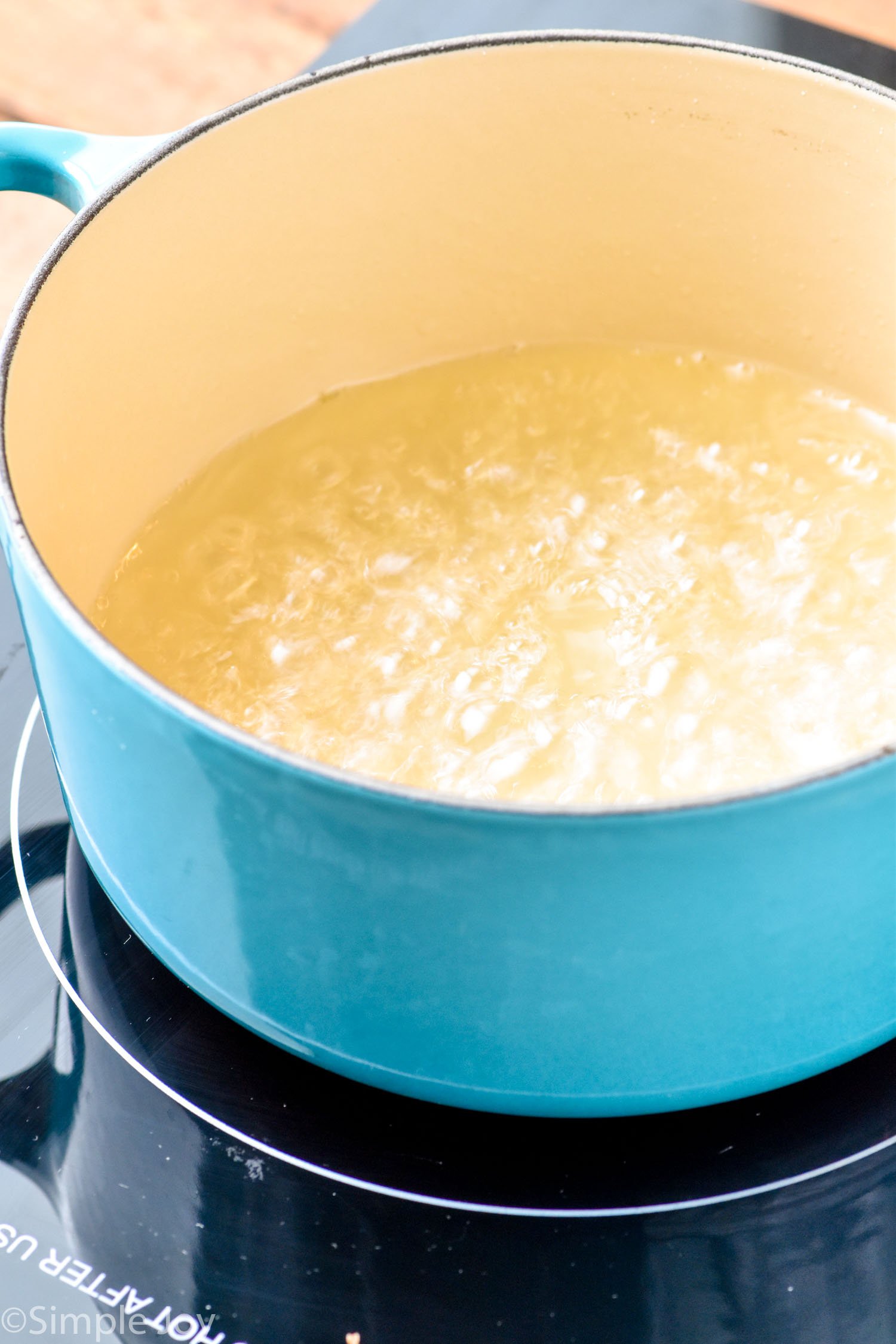 Photo of a pot of boiling liquid for Simple Syrup recipe.