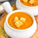Photo of two bowls of Pumpkin Soup garnished with croutons - 8