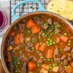 Pinterest graphic for Beef Stew recipe. Text says, "the best Beef Stew recipe simplejoy.com." Image is overhead photo of a pot of Beef Stew with a ladle.