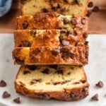 Pinterest graphic for Chocolate Chip Bread recipe. Image shows a partially sliced loaf of Chocolate Chip Bread. Text says, "super easy Chocolate Chip Bread simplejoy.com"