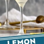 Pinterest graphic for Lemon Drop Martini recipe. Image is side view of two Lemon Drop Martinis garnished with lemon twists. Text says, "Lemon Drop Martini simplejoy.com"