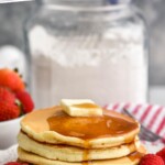 Pinterest graphic for pancake mix. Image shows Plate of pancakes with butter and maple syrup with fresh berries. Container of pancake mix sitting in background. Text says "the best pancake mix simplejoy.com"