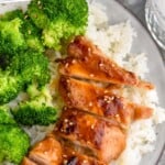 Pinterest graphic for Teriyaki Chicken recipe. Text says, "the best Teriyaki Chicken simplejoy.com." Image shows a plate of Teriyaki Chicken, rice, and broccoli.