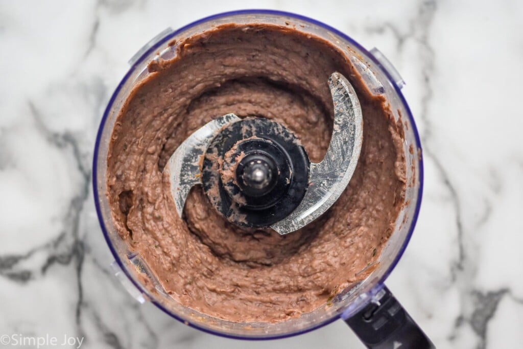 Overhead of food processor of black bean dip