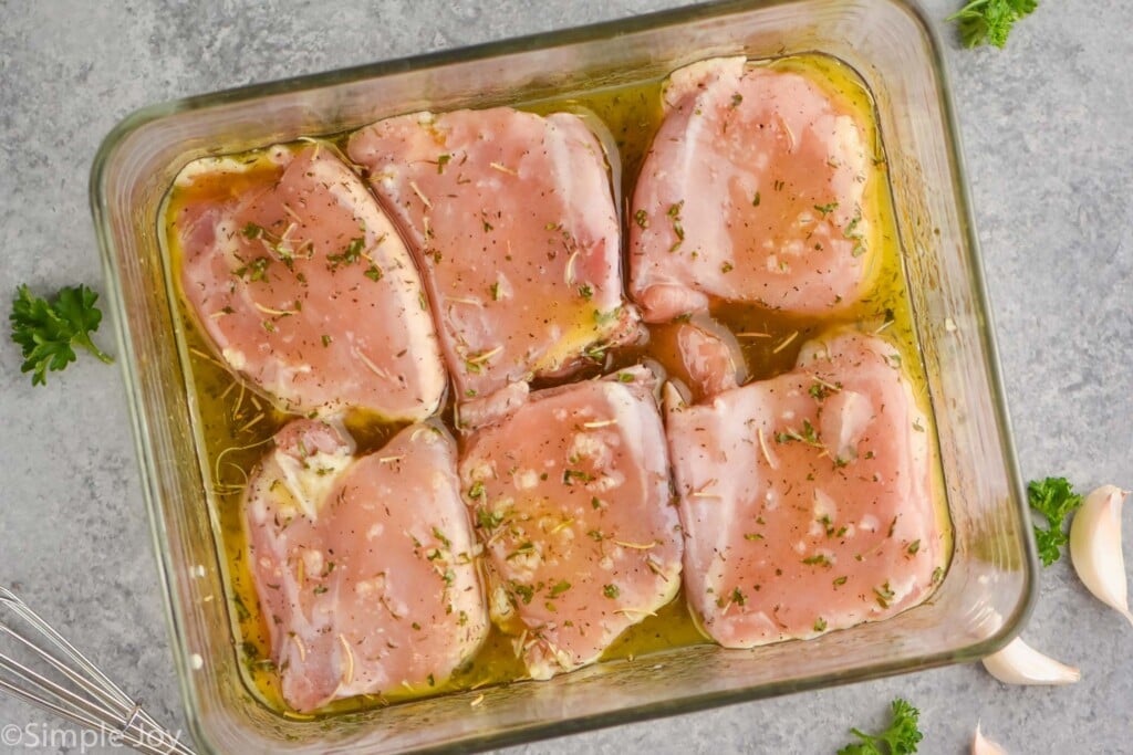 Overhead photo of chicken thighs marinading for Baked Chicken Thighs recipe